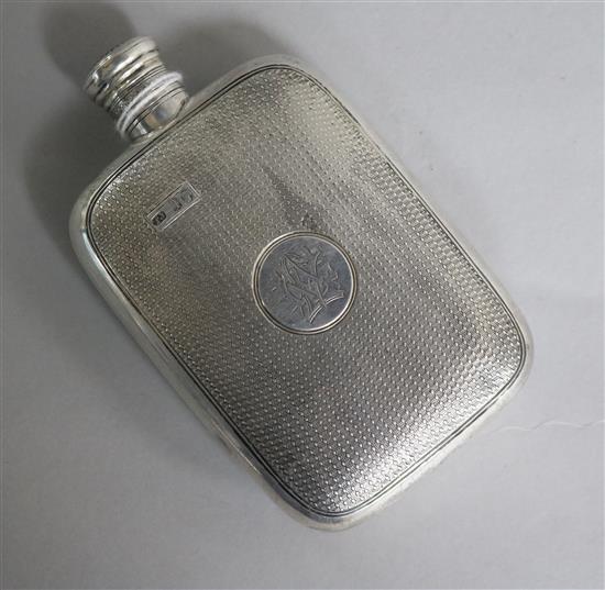 A Victorian engine turned silver hip flask, by Thomas Johnson I, London, 1871, 12cm.